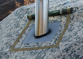 Stove Jack Weather Flap. Seen here rolled up and out of the way for the stove pipe.